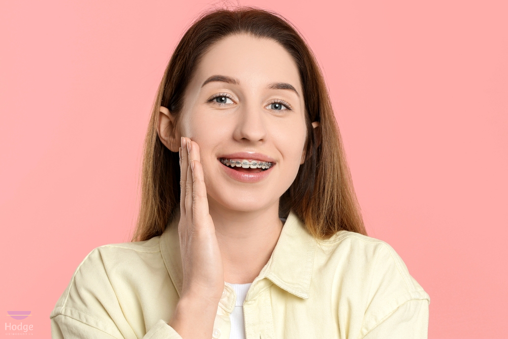 portrait smiling woman metal braces - How to Clean Braces in Little Rock, AR 
